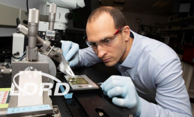 Scientist working at instrument