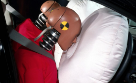 Two test dummies crashing into air bags