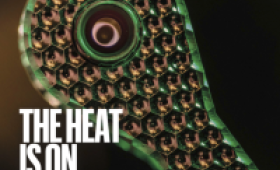 Nature cover with text "The Heat is On" and image of a metal spoon-shaped part