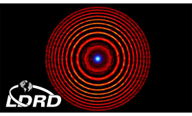 Colorized illustration from a simulation of a holographic plasma lens with red concentric circles