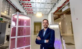 Dayne Fratanduono, deputy NIF director leading the effort for the enhanced yield capability, stands in a critical spot under the NIF beamline.