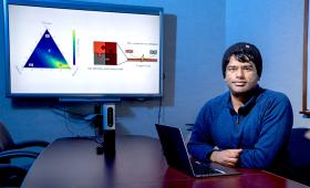 LLNL researcher Nitish Govindarajan sits at table