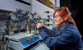 LLNL scientist Maria Gabriela Davila Ordonez manipulates the high-pressure hydrogen system for the Subsurface Hydrogen Assessment, Storage and Technology Acceleration (SHASTA) project