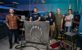 From left to right: Teal Pershing, Jimmy Kingston, Rachel Mannino, Ethan Bernard and Jingke Xu stand with the “XeNu” (Xe-Neutron) setup that calibrates LZ-style dark matter detectors. 