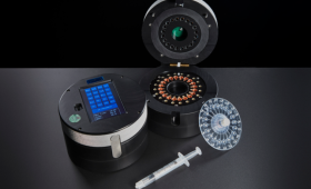 BioID device instrument and consumables. An operating instrument is shown with a blue screen (left), open instrument for cartridge loading (middle) and single-use assay cartridge and sample loading syringe (right). The technology uses isothermal amplification to detect pathogen nucleic acid.