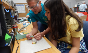 LLNL volunteer teaching a student